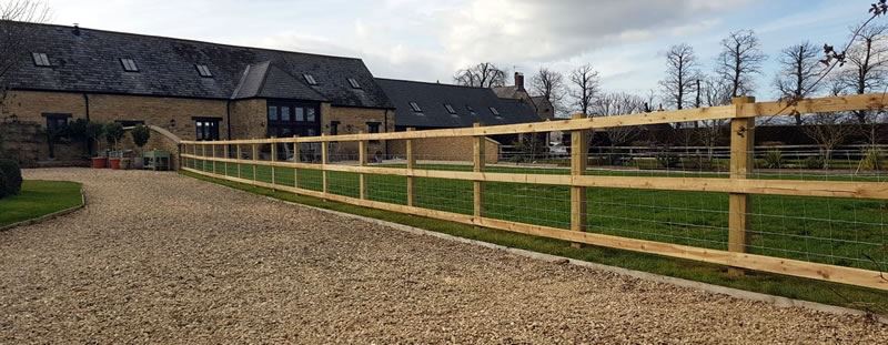 Post and rail fencing along driveway